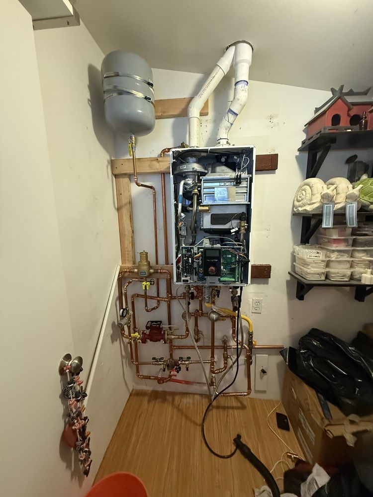 Completed tankless water heater installation with clean copper piping by 5Star Plumbing Commercial